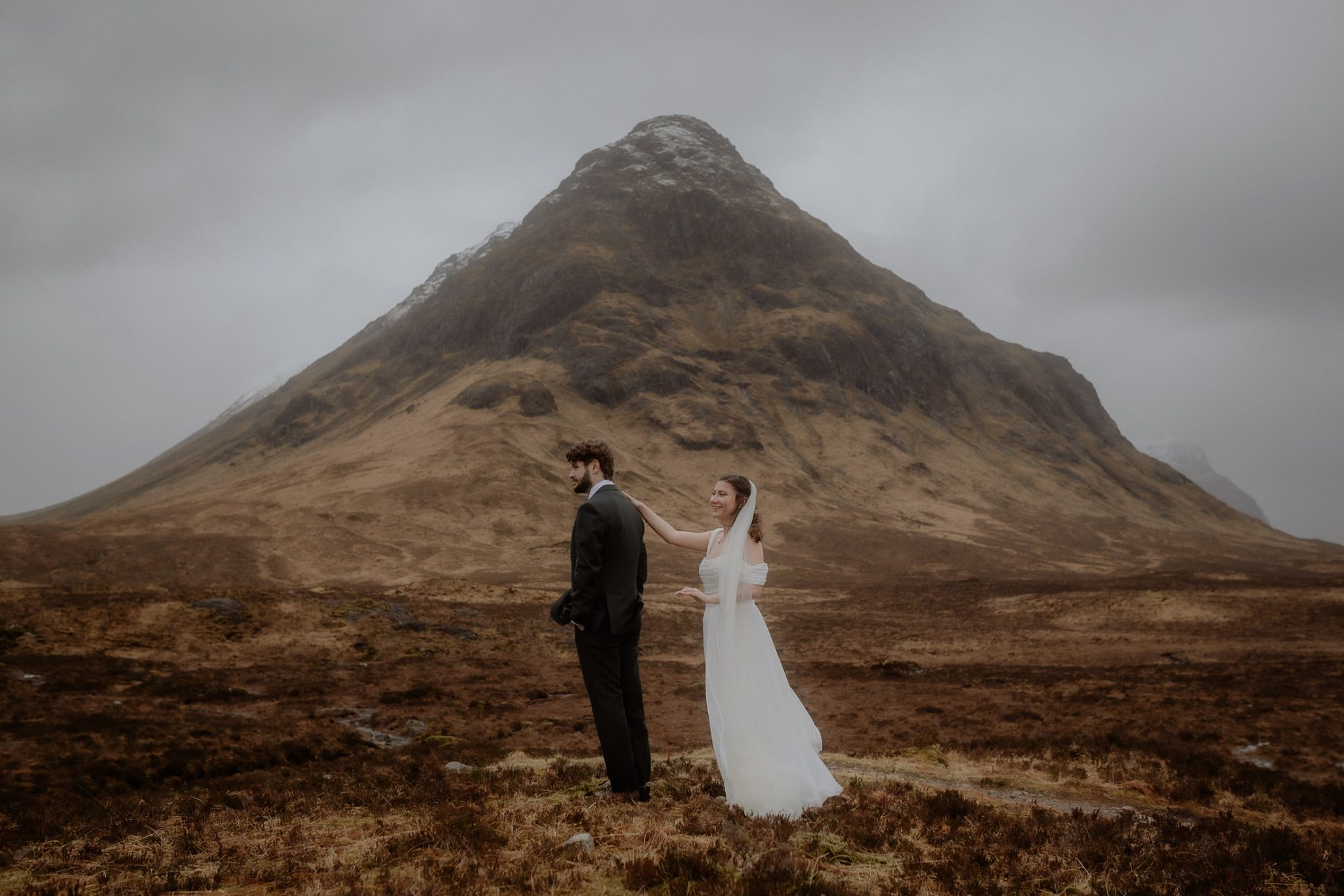 Bride and groom sharing an emotional first look during their Glencoe elopement in the Scottish Highlands.