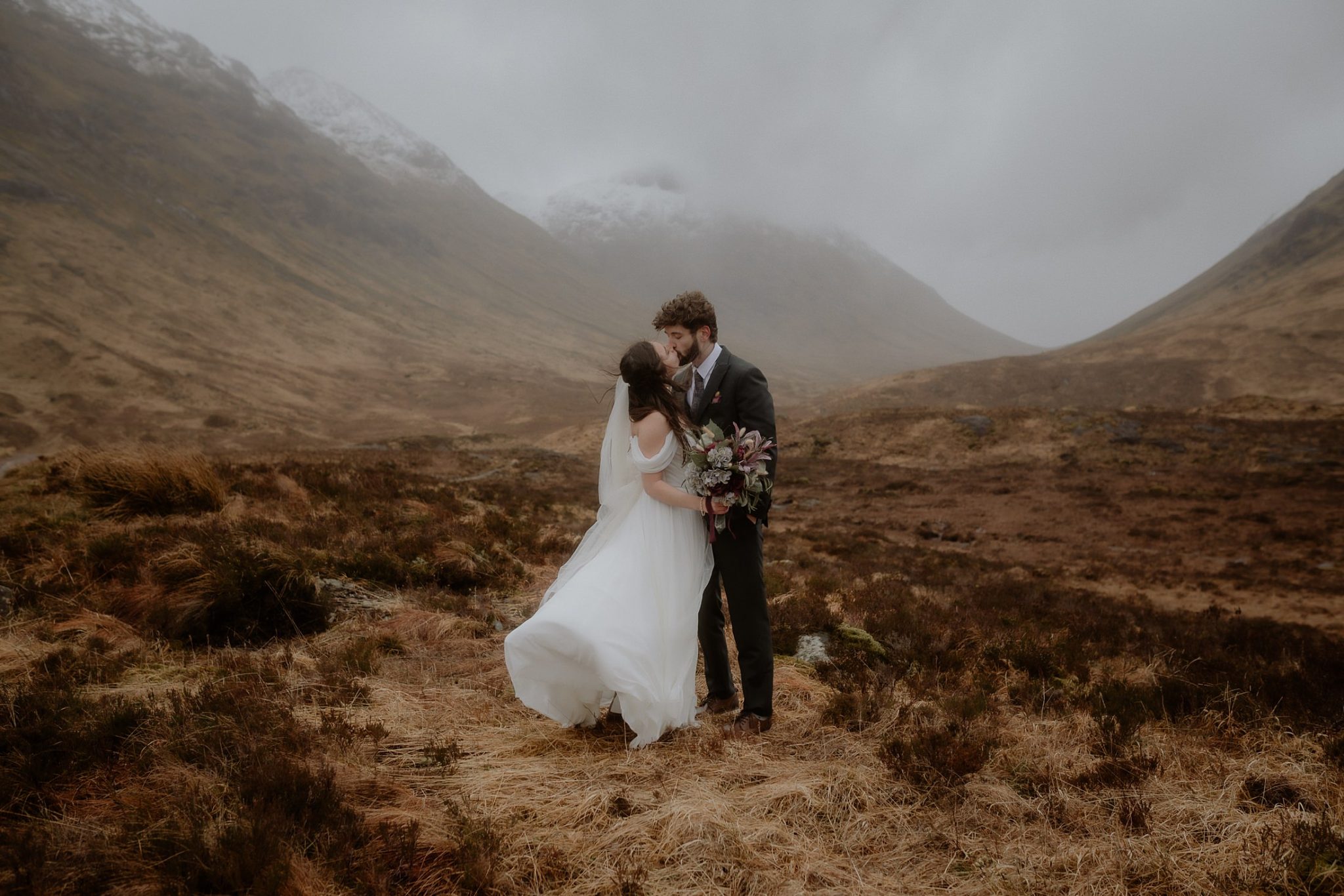 Couple embracing during a Glencoe elopement in the Scottish Highlands