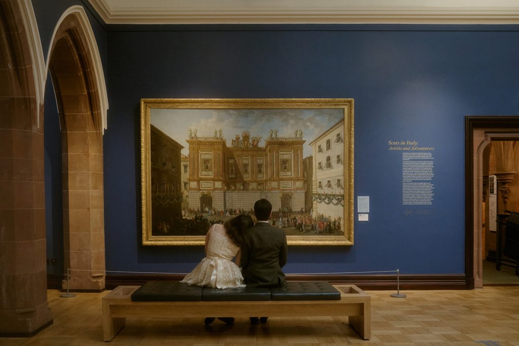 Couple sitting together at the Scottish National Portrait Gallery in Edinburgh.