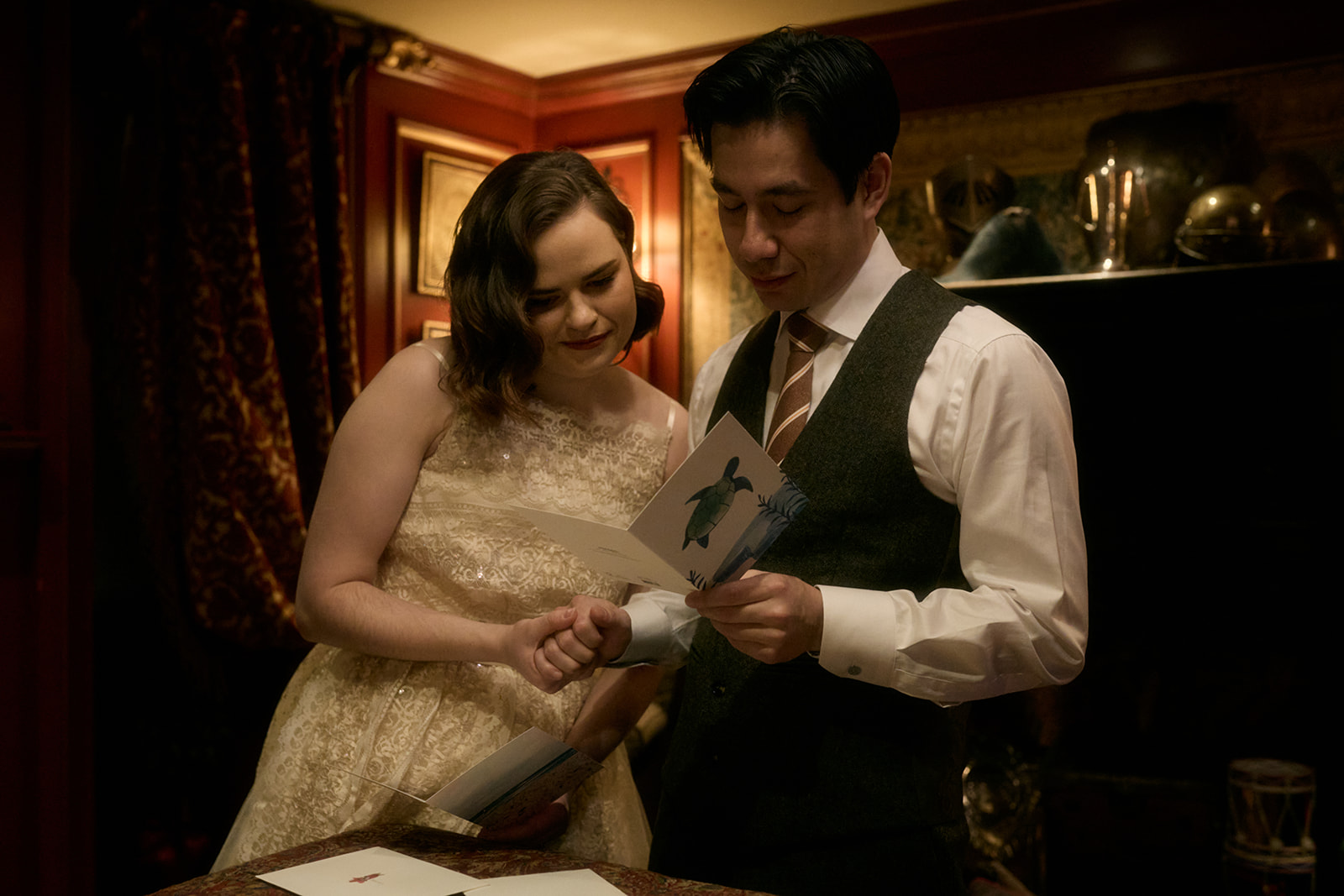 Couple reading cards during an intimate Edinburgh elopement at The Witchery