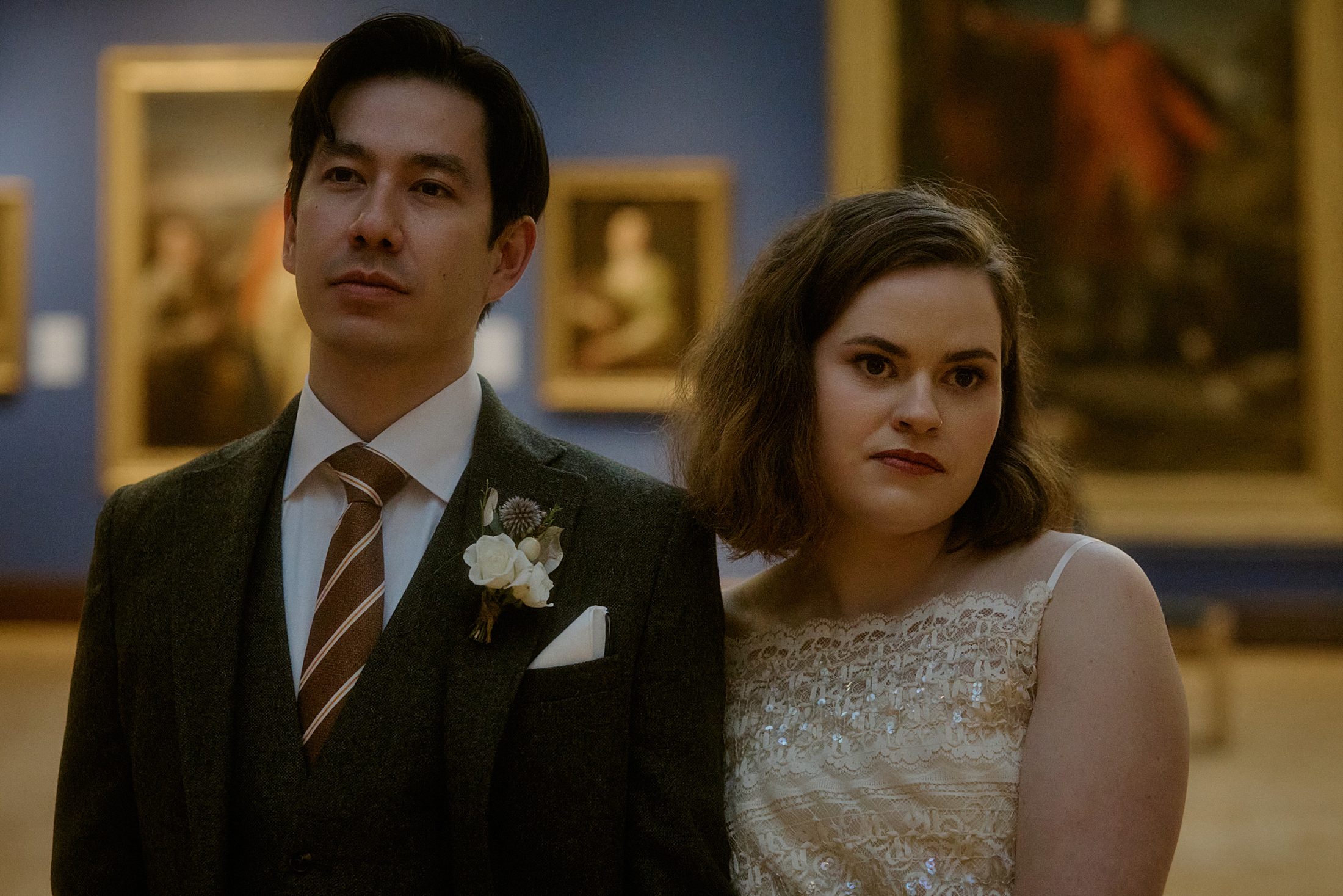 Couple portrait in Scottish National Portrait Gallery Edinburgh after elopement ceremony