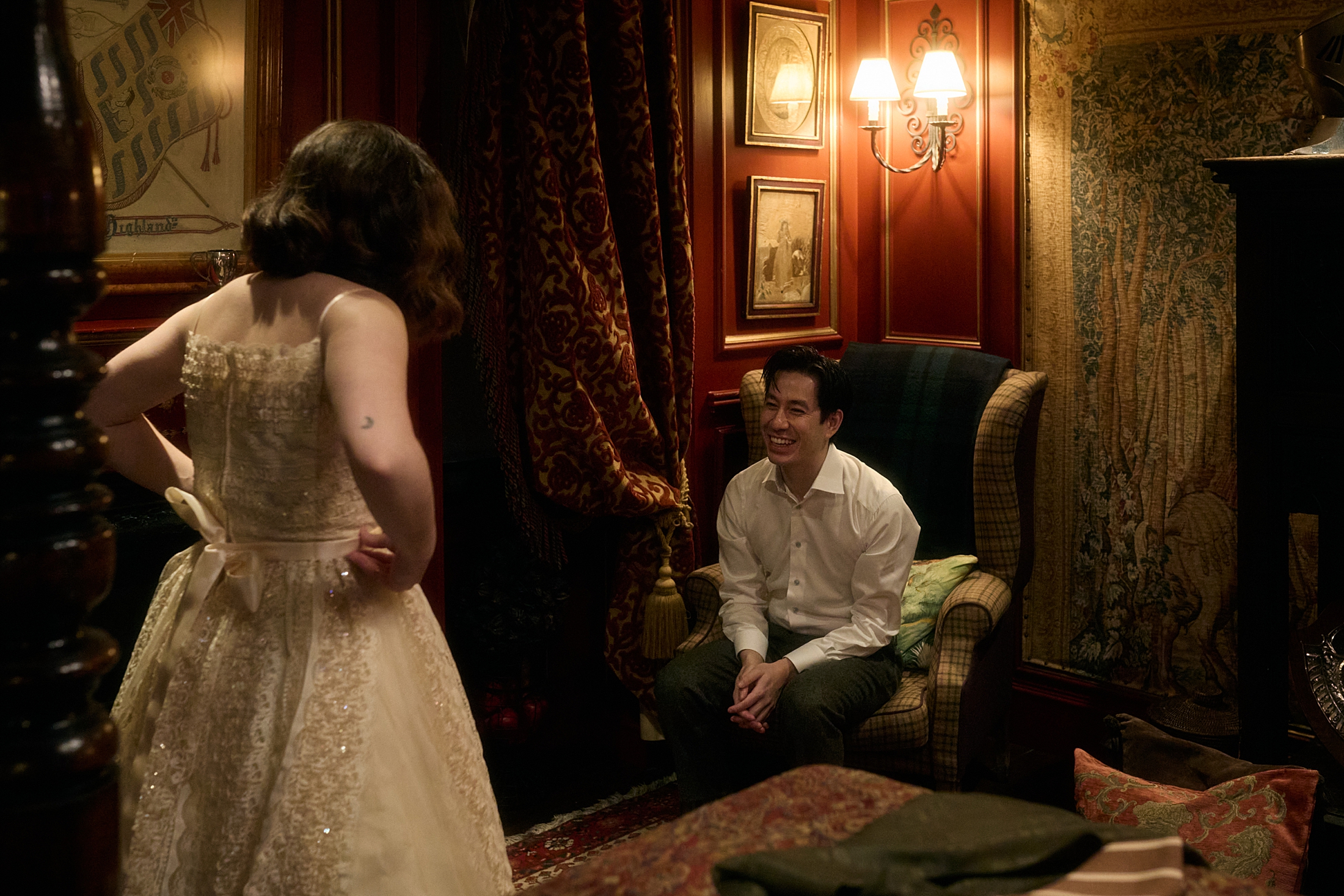 Couple sharing a relaxed moment together at The Witchery in Edinburgh before their ceremony