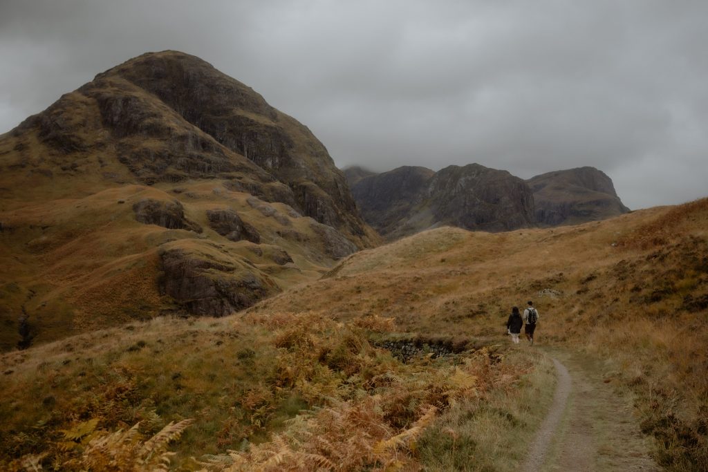 Walking towards the Three Sisters in Glencoe before a surprise proposal in Scotland