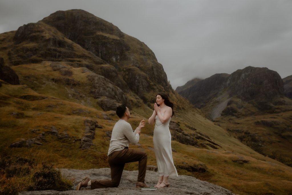 Surprise proposal in Glencoe with dramatic mountain backdrop