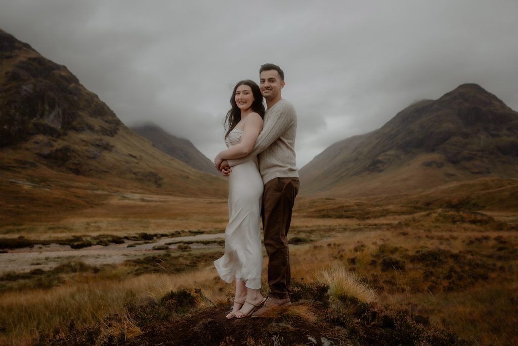 Couple portrait after a surprise proposal in Glencoe valley, Scotland