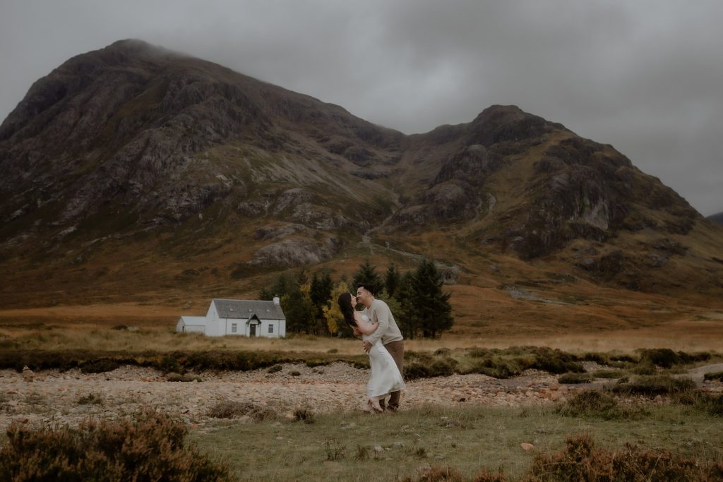 Romantic moment after a surprise proposal in Glencoe, Scotland