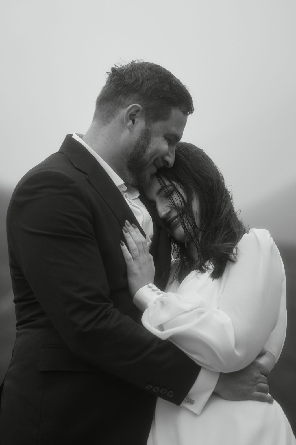 Intimate couple cuddle during elopement in Scotland Highlands