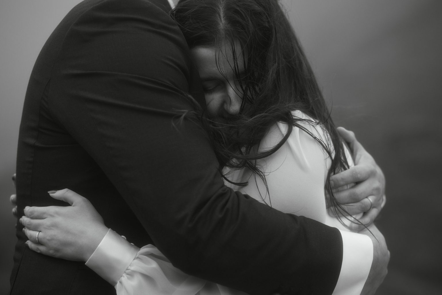 Emotional couple embrace during elopement in Scotland